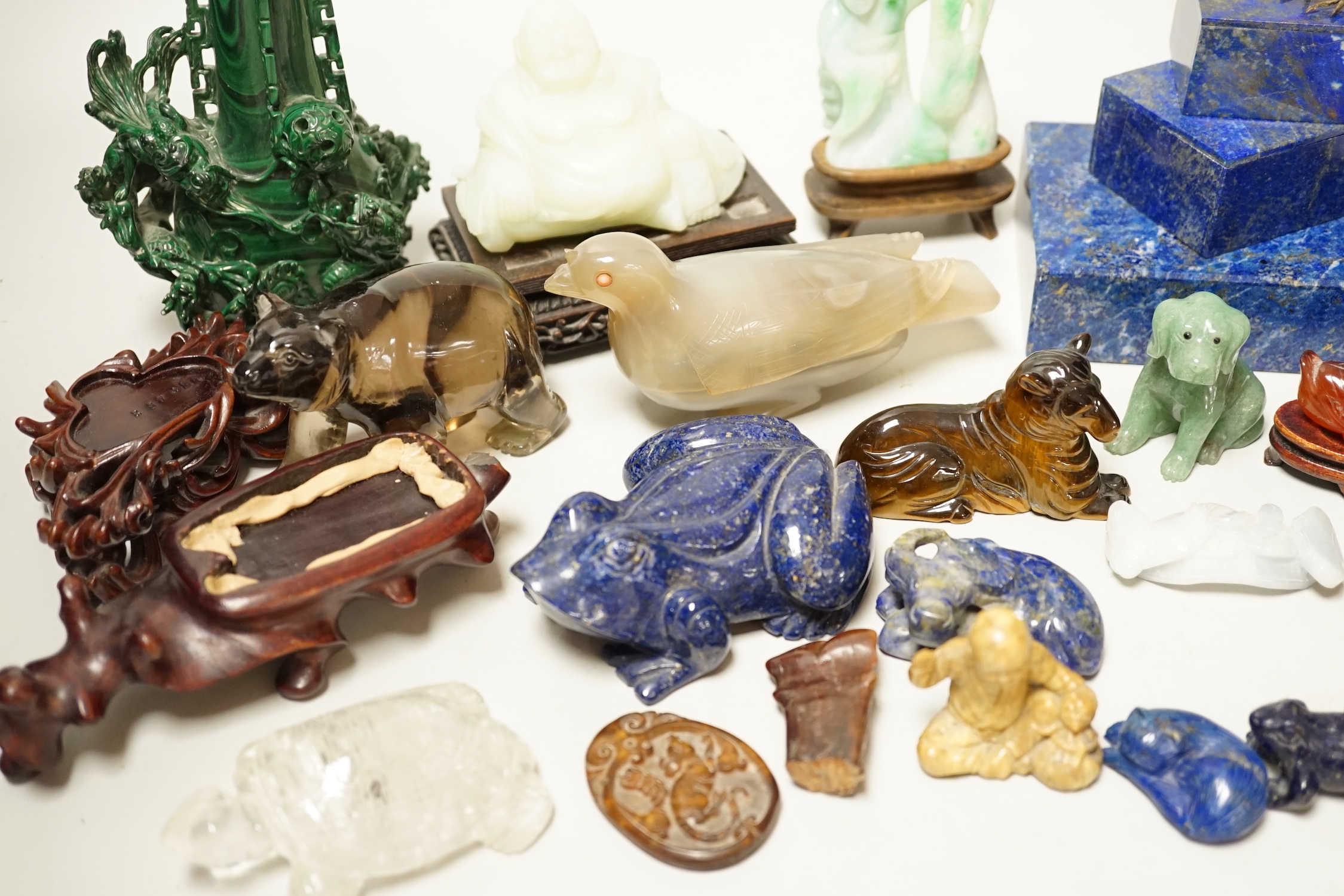 A collection of assorted Chinese hardstone carvings, boxes etc, including a Chinese jadeite carving of a lady, 7.8cm high, wood stand